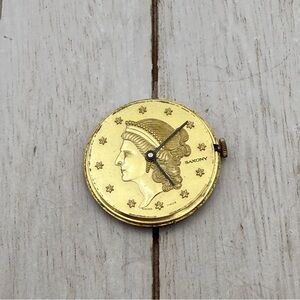 Gold tone saxony Watch face